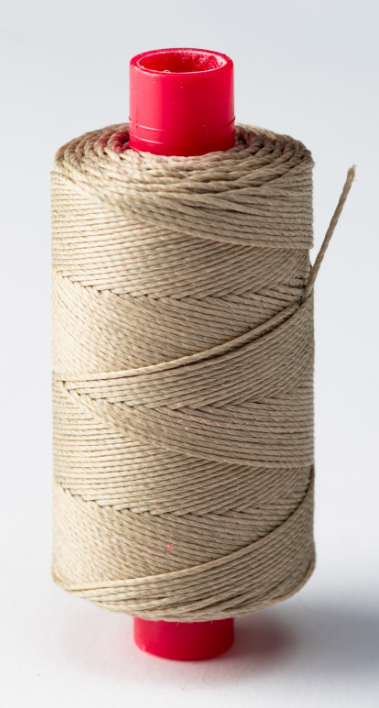 Photo of Amati B4124,63 model ship rope, 0.75mm x 100m, displaying texture and coil