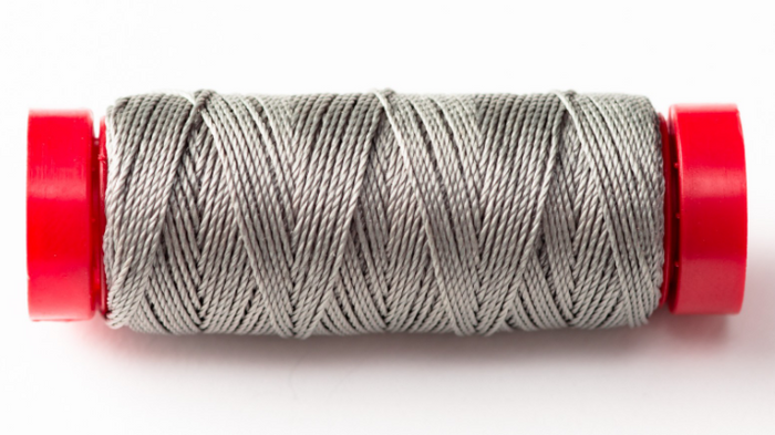 Photo of Amati B4127,06 gray rope, showing the texture and color detail on a white background.