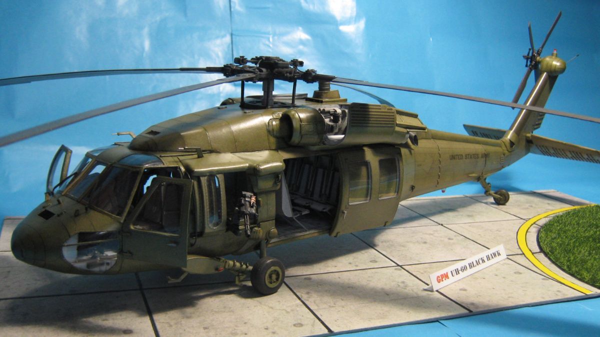 Photo of a Sikorsky UH-60 Black Hawk cardboard model kit on a white background, showcasing the detailed design and scale.