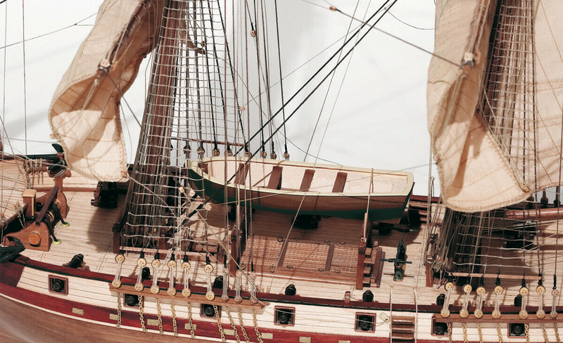 Image of Occre's Corsair Brig 1:80 Scale Model (13600), depicting a detailed replica of the traditional brig ship, complete with intricate rigging, precision-cut wooden parts, and authentic nautical details.