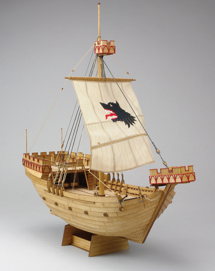 Photo of Wütender Hund - Kogge von 1390, a 1:72 scale wooden model ship kit, featuring laser-cut parts, engraved planks, rigging accessories, and detailed historical design.