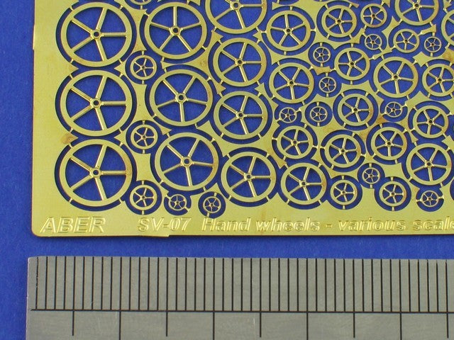 Photo of ABER (RE-SV-07) Hand Wheels Type A for scale warship models, showing finely detailed brass components in various sizes.