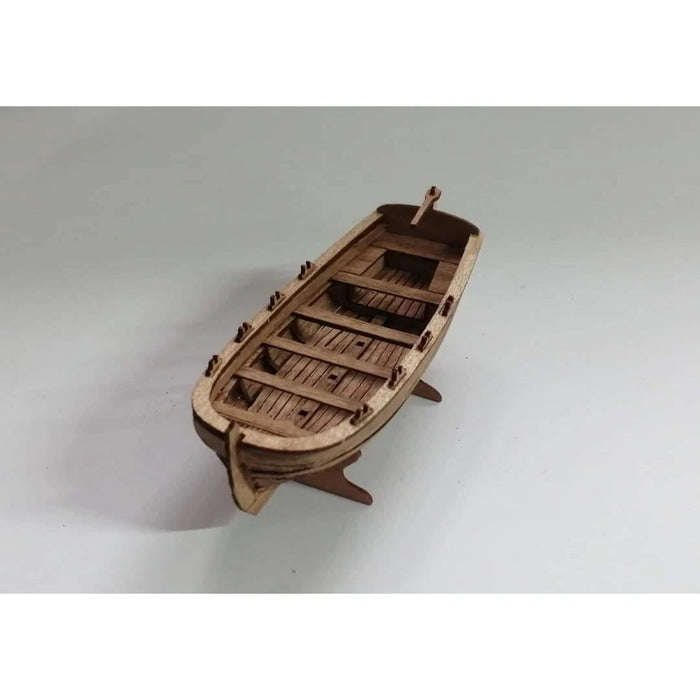 Photo of Wooden Model Kit Rowing Boat Scale 1:72 by ModelNet – parts and instructions displayed.
