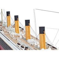 Photo of Amati Titanic 2025 Edition model kit, featuring realistic deck details, transparent domes, and photo-etched enhancements in 1:250 scale.