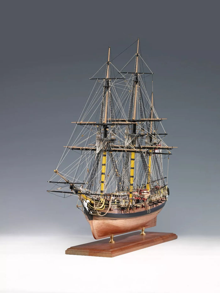 Photo of the Amati HMS Pegasus wooden model ship kit in 1:64 scale, showcasing premium materials and detailed components.