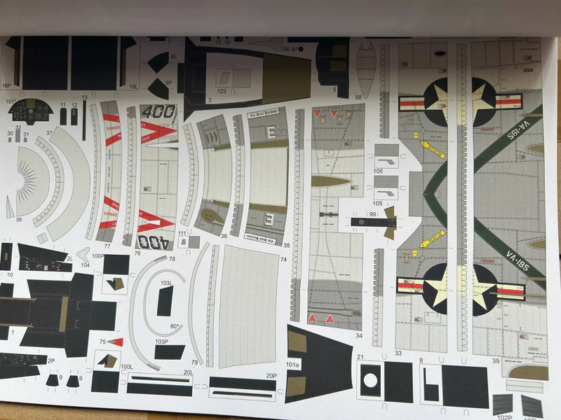 Photo of the LTV A-7E Corsair II card model kit in 1:33 scale from Answer/MS Model Publishing, showcasing intricate details and high-quality materials.