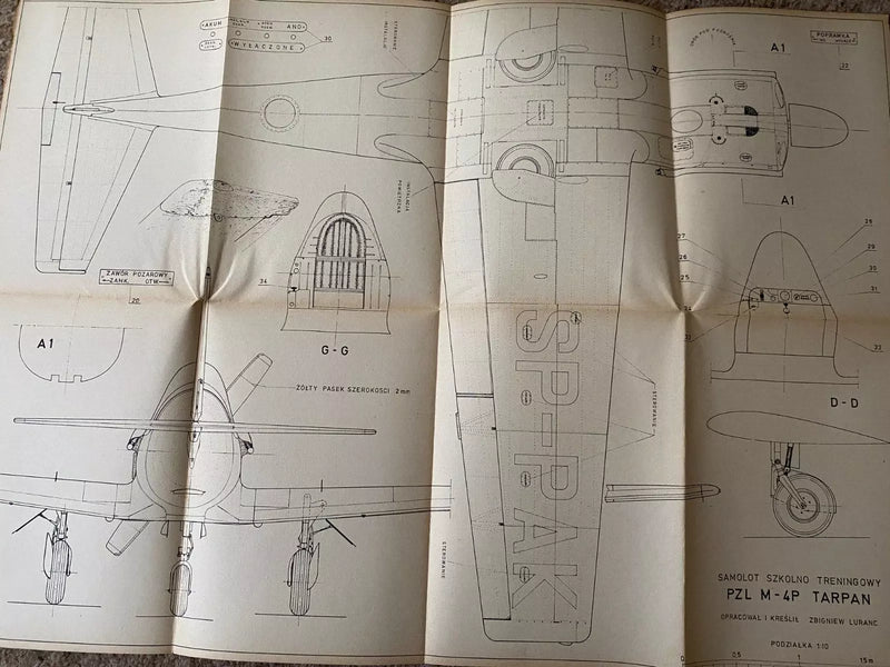 Photo of vintage 1977 PZL M-4 Tarpan construction plans by LOK, showing A1 sheets with detailed aircraft drawings and Polish text.