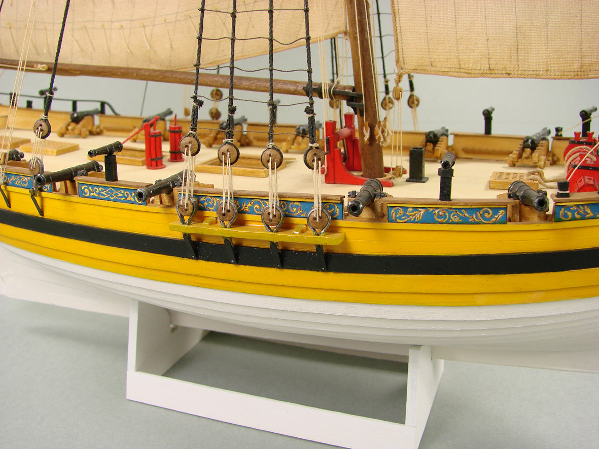Image of Shipyard's HMS ALERT 1:96 card model kit, showcasing detailed laser-cut parts and the intricacy of the historic British cutter, ideal for model ship enthusiasts.