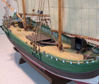 Image of the TRABACCOLO 1:100 scale card model kit by WAK Publishing, showcasing the kit's detailed components and design for a historically accurate replica.